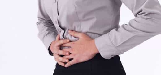 Woman clutching stomach in pain